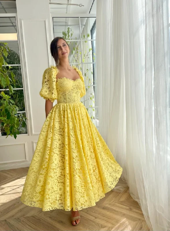 Midi dresses with keyhole backs for a flirty and unexpected detailLemon Blossom Midi Dress Midi dresses with keyhole backs for a flirty and unexpected detailLemon Blossom Midi Dress