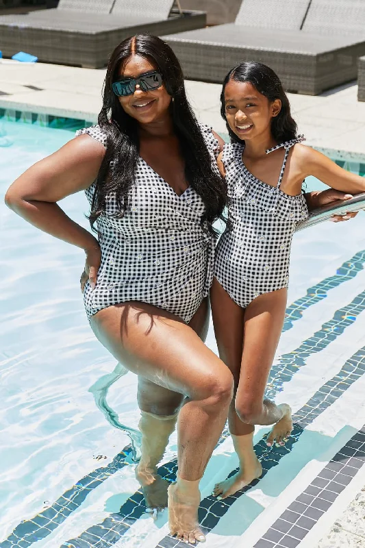 Women's Metallic One - Pieces in Silver for a Shiny and Eye - Catching Night OutfitMarina West Swim Full Size Float On Ruffle Faux Wrap One-Piece in Black