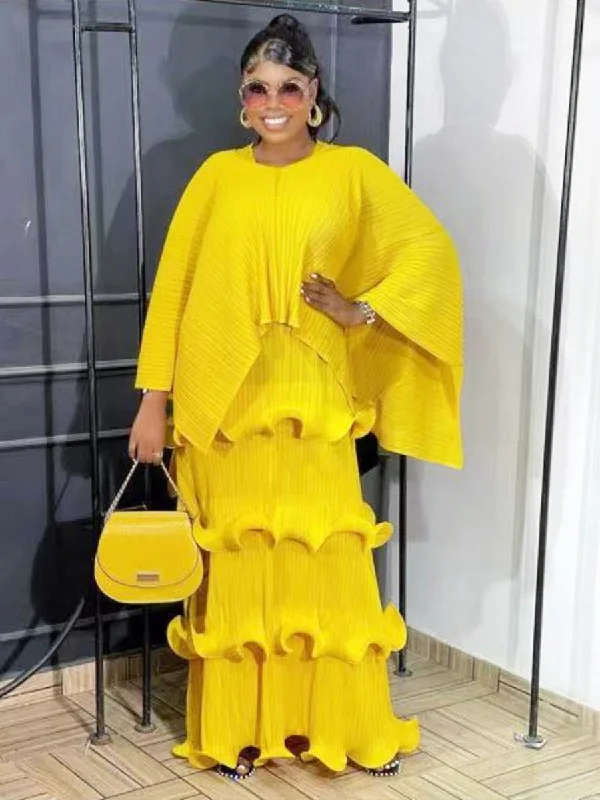 Sheer maxi dresses with lace overlays for a romantic touch Sheer maxi dresses with lace overlays for a romantic touch Miyake Pleated Irregular Shawl Top & Tiered Maxi Dress Set
